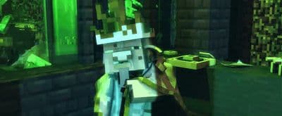 a minecraft character standing in front of a computer screen