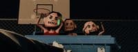 a group of cartoon heads sitting on top of a basketball court