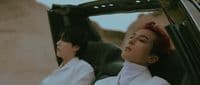 a couple of women sitting in the back of a car