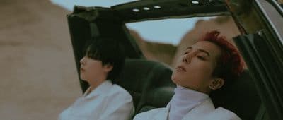 a couple of women sitting in the back of a car