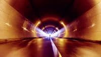 a long tunnel with a light at the end