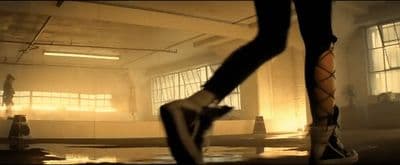 a person standing in a room with their feet on the floor