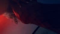 a close up of a person's head with a red light