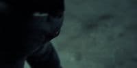 a blurry image of a man in a dark room