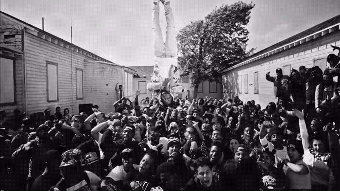 a large group of people standing in front of a building