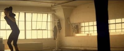a person standing in a room with a window