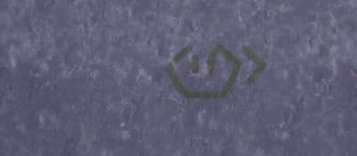 a close up of a street sign on the ground