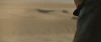a blurry photo of a person walking in a field