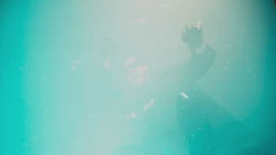 a blurry photo of a person in the water