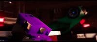 a close up of a purple and green object