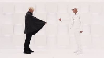 a couple of men standing next to each other