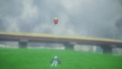 a person on a field with a ball in the air