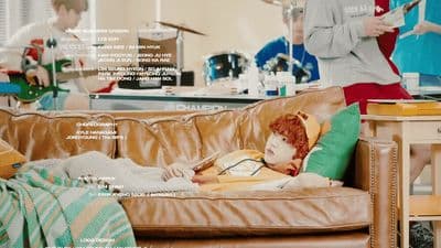a woman sitting on a couch in a living room