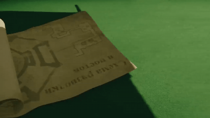 a brown paper bag sitting on top of a green table