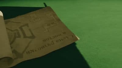 a brown paper bag sitting on top of a green table