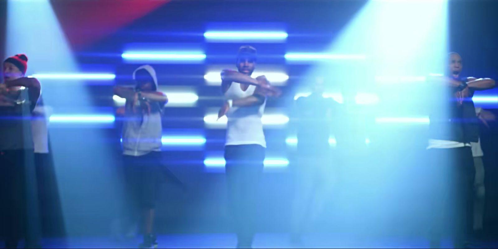 a group of people standing on top of a stage
