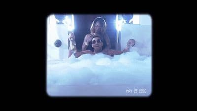 a group of people in a bathtub with bubbles