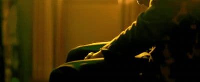 a blurry photo of a person sitting in a chair