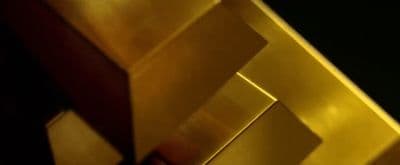 a close up of a metal object with a black background