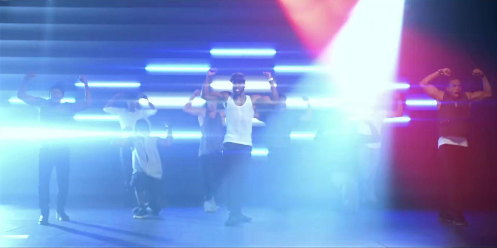 a group of people standing on top of a stage