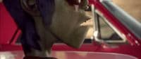 a close up of a person wearing a mask