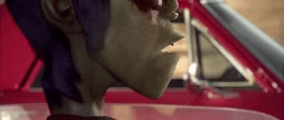 a close up of a person wearing a mask