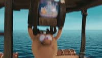 a person holding a cell phone up to their face