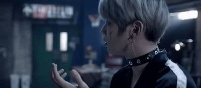 a woman in a black shirt is talking to someone
