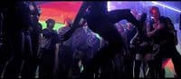a group of people dancing in a club