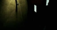 a door is open in a dark room