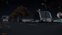 a cartoon character standing on the side of a road at night