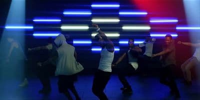 a group of people dancing on a stage