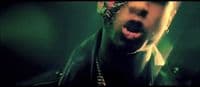 a man with his mouth open wearing a bandana