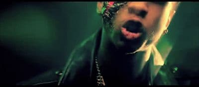 a man with his mouth open wearing a bandana