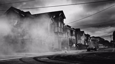 a black and white photo of smoke coming out of a fire hydrant