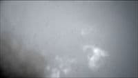 a black and white photo of a plane in the sky