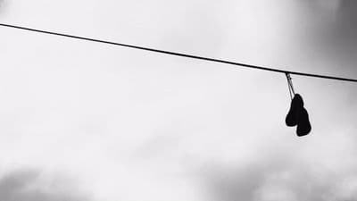 a pair of boxing gloves hanging from a wire