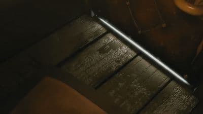 a wooden bench with a light on top of it