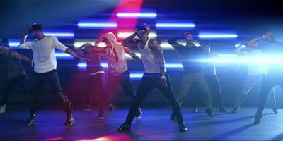 a group of people dancing on a stage