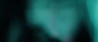a blurry photo of a green curtain