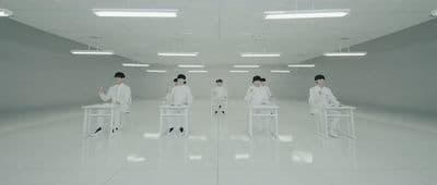 a group of people sitting in chairs in a room