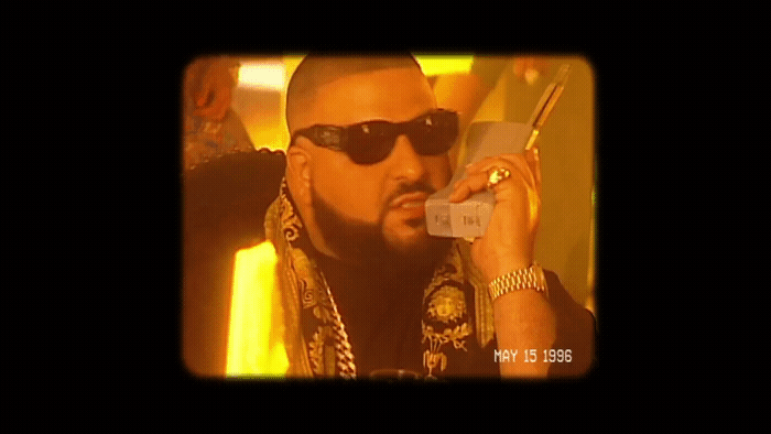 a man in sunglasses talking on a cell phone