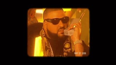 a man in sunglasses talking on a cell phone