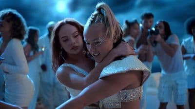 a couple of women standing next to each other