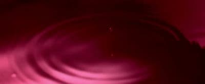 a blurry image of a red and pink background