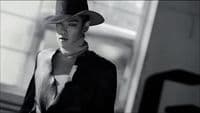 a woman wearing a hat and a scarf