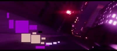 a blurry image of a city street at night