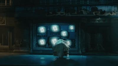 a person standing in front of a building at night