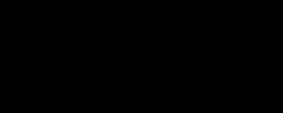 a man in a suit and tie standing in front of a black background