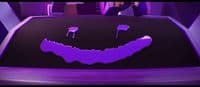 a purple car with a smiley face painted on it